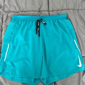 Nike Teal Athletic Shorts 7”
Work a couple times